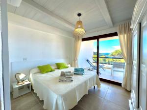 223 Seafront Apartment with Beach Access in Baja Sardinia - by Coral Property