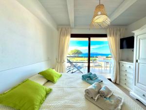 223 Seafront Apartment with Beach Access in Baja Sardinia - by Coral Property