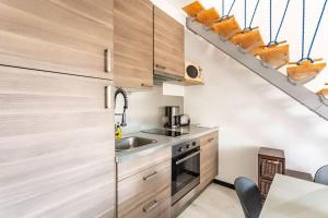 Appartements Le Capucin - Petit duplex avec place de parking : photos des chambres