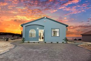 Sunset at ArecaHomes Beach Access Pool and Water Park
