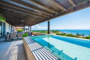 PH Vista Ballena in Tau by Mita Residential Staff Golf Cart Ocean Golf View Pool