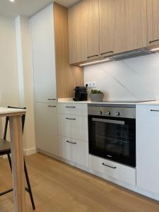 Apartamento R14 en Miño con 2 dormitorios, salón-cocina, 1 baño y zona de lavandería, situado cerca de las playas