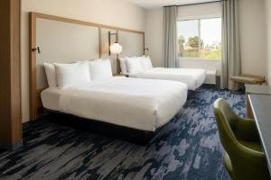 Queen Suite with Two Queen Beds and Sofa Bed room in Comfort Suites Old Town