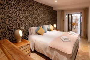 Maisons de vacances Maison avec patio et jacuzzi : photos des chambres