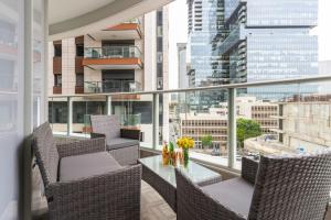 Sunlit Urban Escape with Balcony with Mamad by Sea N' Rent