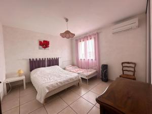 Maisons de vacances Villa pour 8 avec clim et parking proche de la mer : photos des chambres