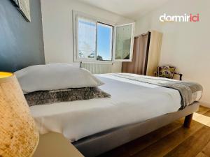 Appartements SOLEIL LEVANT - Terrasse, clim, jardin & BBQ : photos des chambres