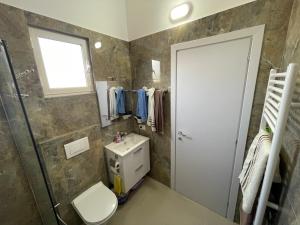 Střešní apartmán s terasou, zahradou a výhledem na moře