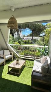 LE BOHÈME - balcon vue jardin - clim - place de parking - wifi - 5min plage