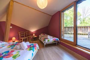 Maisons de vacances Charmante Maison en Bois : photos des chambres