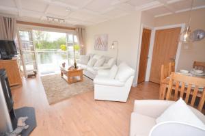 Dutch Cottage sits in its own basin off the River Bure in Horning