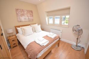 Dutch Cottage sits in its own basin off the River Bure in Horning