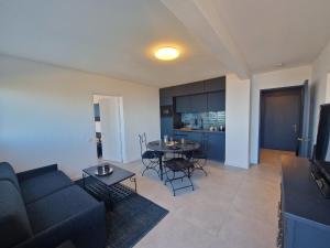 Appartements Appartement avec piscine Bleu du Lac : photos des chambres