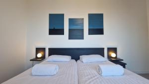 Appartements Appartement avec piscine Bleu du Lac : photos des chambres
