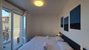 Appartements Appartement avec piscine Bleu du Lac : photos des chambres