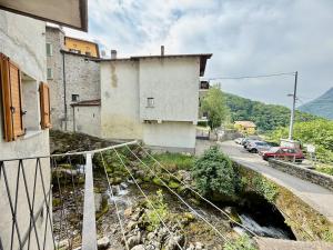 A house between a waterfall and a lake the enchantment of Nesso
