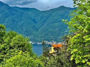 A house between a waterfall and a lake the enchantment of Nesso