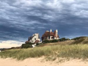 Appartements Beach & Golf Cabourg - 50m2 avec jardin clos a 100m golf Cabourg et 200m plage de Cabourg le Home : photos des chambres