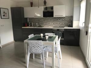 Appartements Beach & Golf Cabourg - 50m2 avec jardin clos a 100m golf Cabourg et 200m plage de Cabourg le Home : photos des chambres