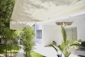 Al Motameyez Stylish 2BR Retreat with Private Garden