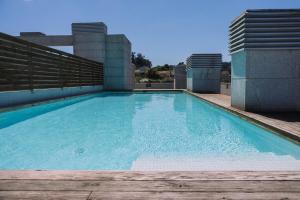 Piscina y garaje cerca del centro by CABANA Rentals