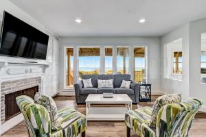 New Listing! Stunning Oceanfront 4-bedroom 3 bath house nestled on the quiet end of the island.