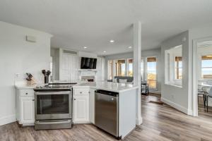 New Listing! Stunning Oceanfront 4-bedroom 3 bath house nestled on the quiet end of the island.