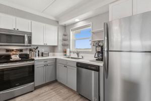 Experience beachfront luxury at 663 Amelia by the Sea, a spacious 2-bedroom condo.