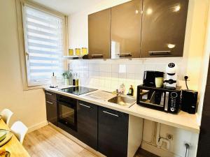 Appartements L-Escali-Bulle - Entre Gare et Centre-ville : photos des chambres