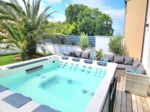 Maisons de vacances Les Alizes - Maison 4 chambres - Jacuzzi/Sauna : photos des chambres