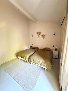 Villas Maison de ville piscine chauffee : photos des chambres