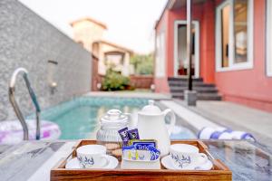 ELIVAAS Irene Ruby 6-BHK Retreat with Private Pools, Gardens, and Balconies