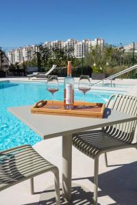 Modern 4-Person Apartment with Pool & Indoor Parking