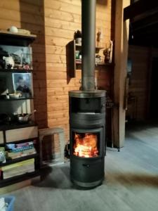 Sejours chez l'habitant Suite parentale dans maison en bois calme - frigo, vue jardin : photos des chambres