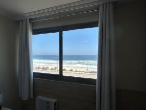 Cobertura duplex frontal ao mar