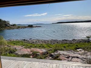 Cottage with own beach, seaterrace & pavillion.