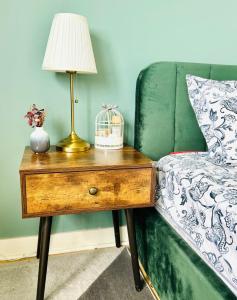 Un Cocon Vert Canard à côté Paris 14ème - 3 pièce de 70m2 avec 2 chambres et un grand salon lumineux