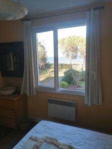 Maisons de vacances Maison avec jardin face au lac et plage : photos des chambres