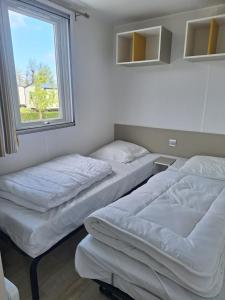 Campings Camping L'oiseau Blanc : photos des chambres