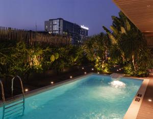 M Village Hotel Premier Thi Sách