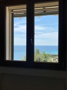 CASA ELAIO - immersa negli ulivi con vista sul mare Ionio