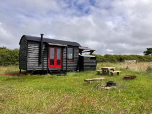 Shepherds Hut in a private meadow with sea views