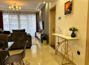 beautifully and elegantly furnished apartment with fully equipped gym, swimming pool ,private parking space ,,children playing ground and unbeatable city views in lavington