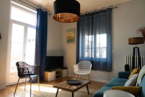 Appartements Au Petit Pelloutier : photos des chambres