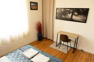 Appartements Au Petit Pelloutier : photos des chambres