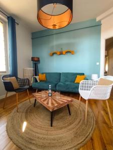 Appartements Au Petit Pelloutier : photos des chambres