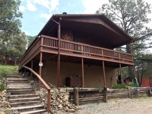 Horsin’ Around-Cabin with a peaceful covered deck.