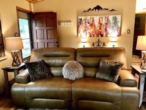 Horsin’ Around-Cabin with a peaceful covered deck.