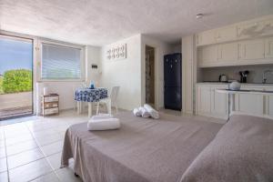 GuestHost - Cozy Open-Plan Apartment in Sardinia