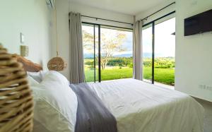 Modern Villa Surrounded by Nature and Gardens with Pool and Stunning Mountain and River Views